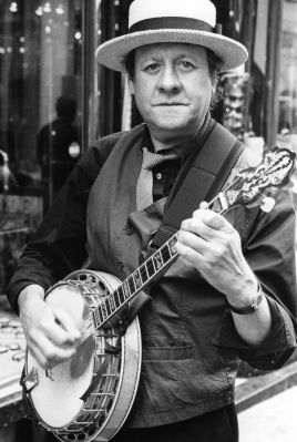 A man's playing in the street...

