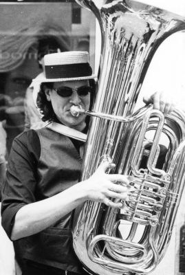 A man's playing in the street...
